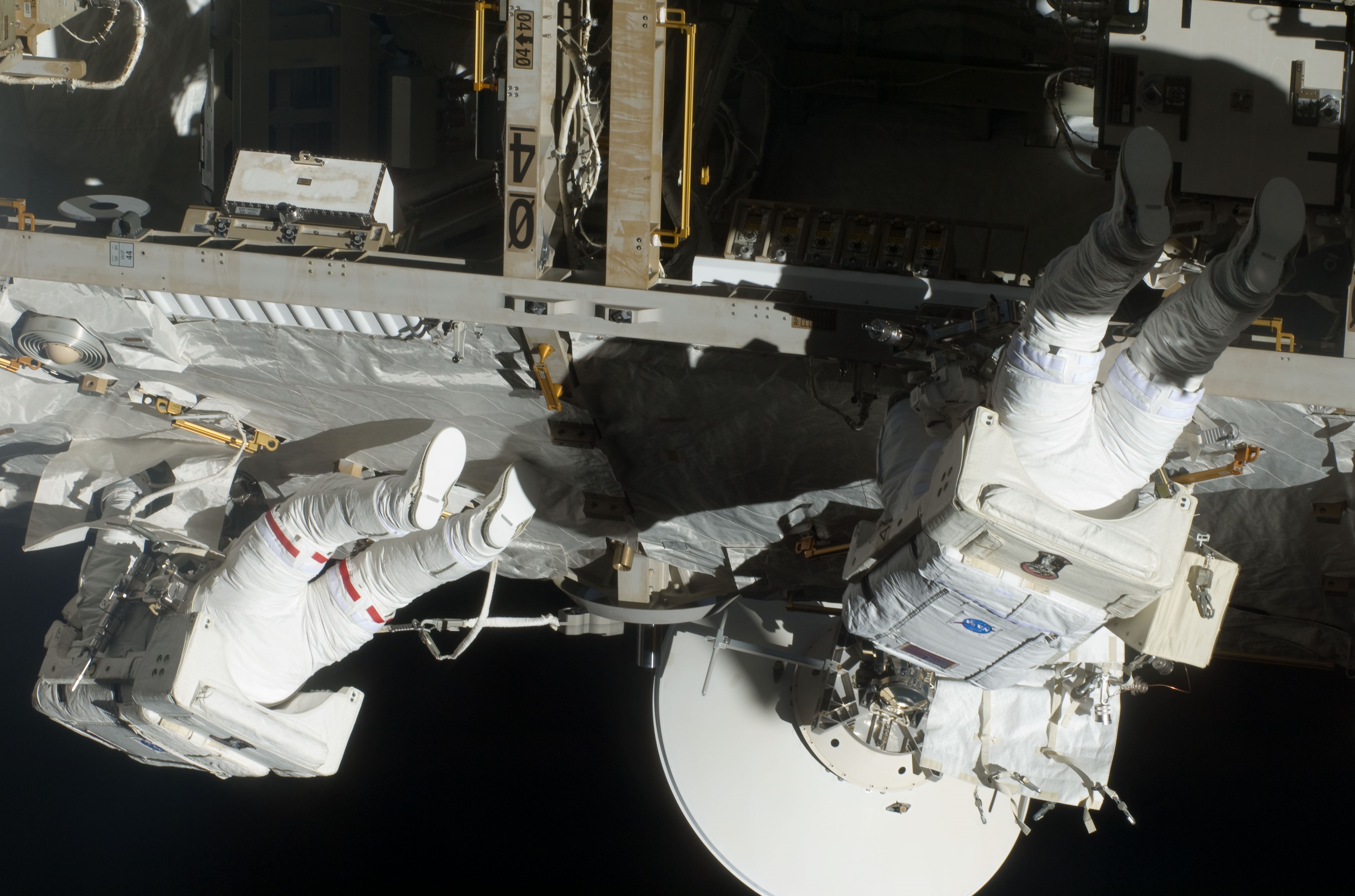 Olivas, left, and A. Christer Fuglesang work on the space station truss