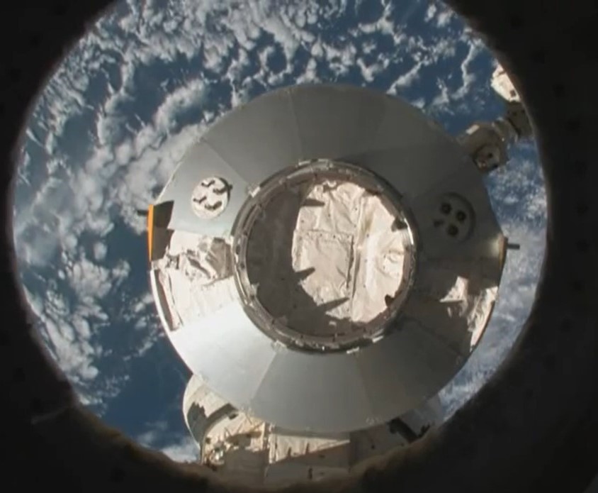 Astronauts robotically stow the Leonardo Multi-Purpose Logistics Module (MPLM) back in Discovery’s payload bay