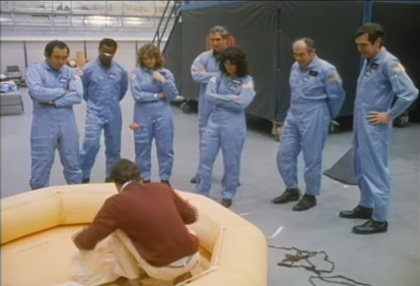 The STS-51L crew receives a briefing on water evacuation