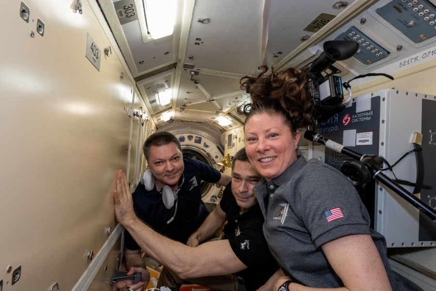 Expedition 71 crew members (from left) Oleg Kononenko and Nikolai Chub, both Roscosmos cosmonauts, and NASA astronaut Tracy C. Dyson pose for a portrait inside the International Space Station's Rassvet module.