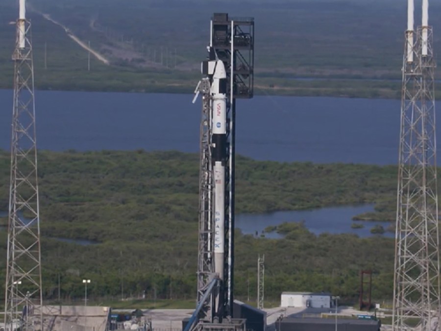 Image of SpaceX Dragon spacecraft atop a Falcon 9 rocket ahead of NASA's SpaceX Crew-9 mission to the International Space Station.