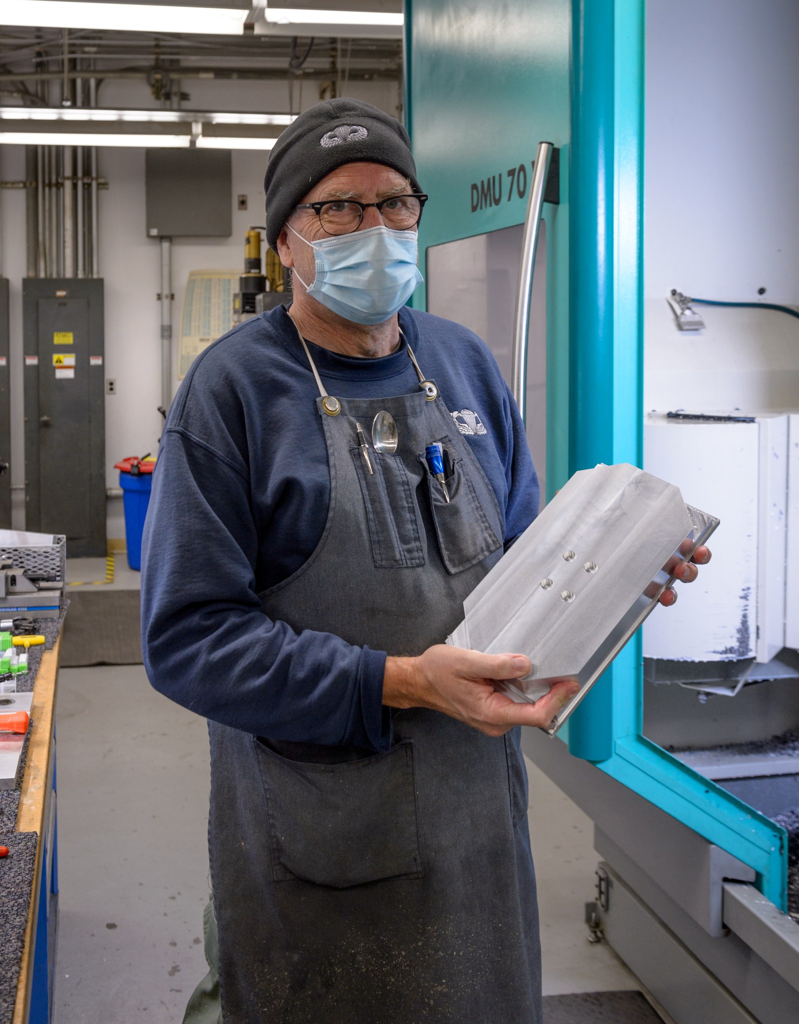 Portrait photo of NASA Ames Research mechanical technician Emmett Quigley holding