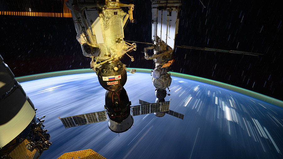 Star trails, streaks of city lights, and two Soyuz crew ships are pictured as the space station orbited above central China.