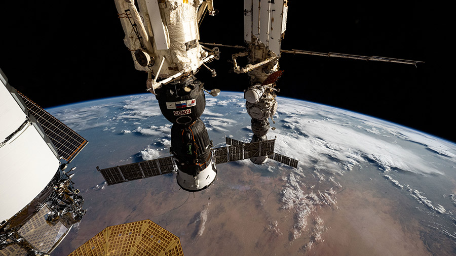 The Soyuz MS-26 (foreground) and MS-25 (background) crew ships are pictured docked to the International Space Station as it orbited above Africa.