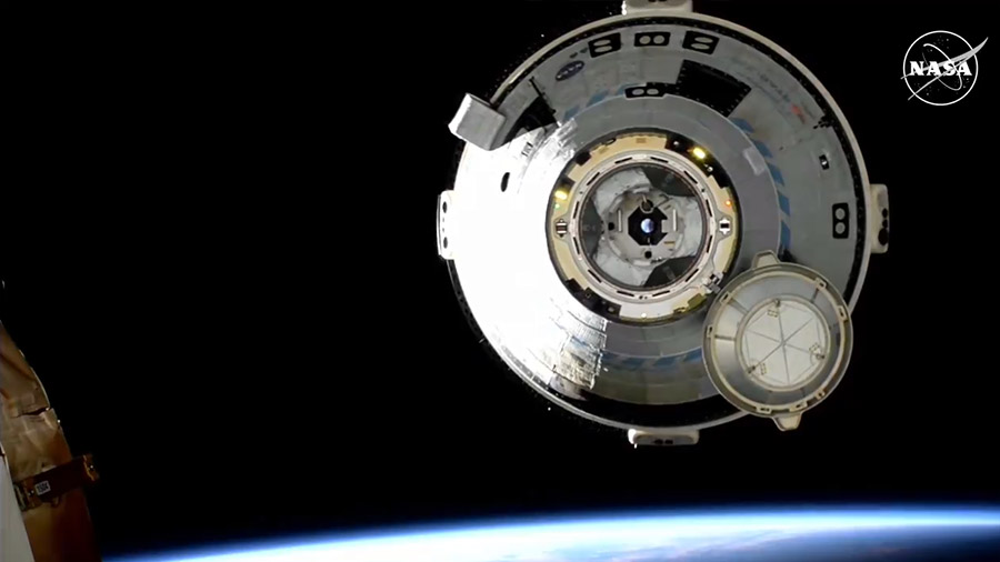 The uncrewed Starliner spacecraft backs away from the International Space Station shortly undocking from the Harmony module. Credit: NASA+