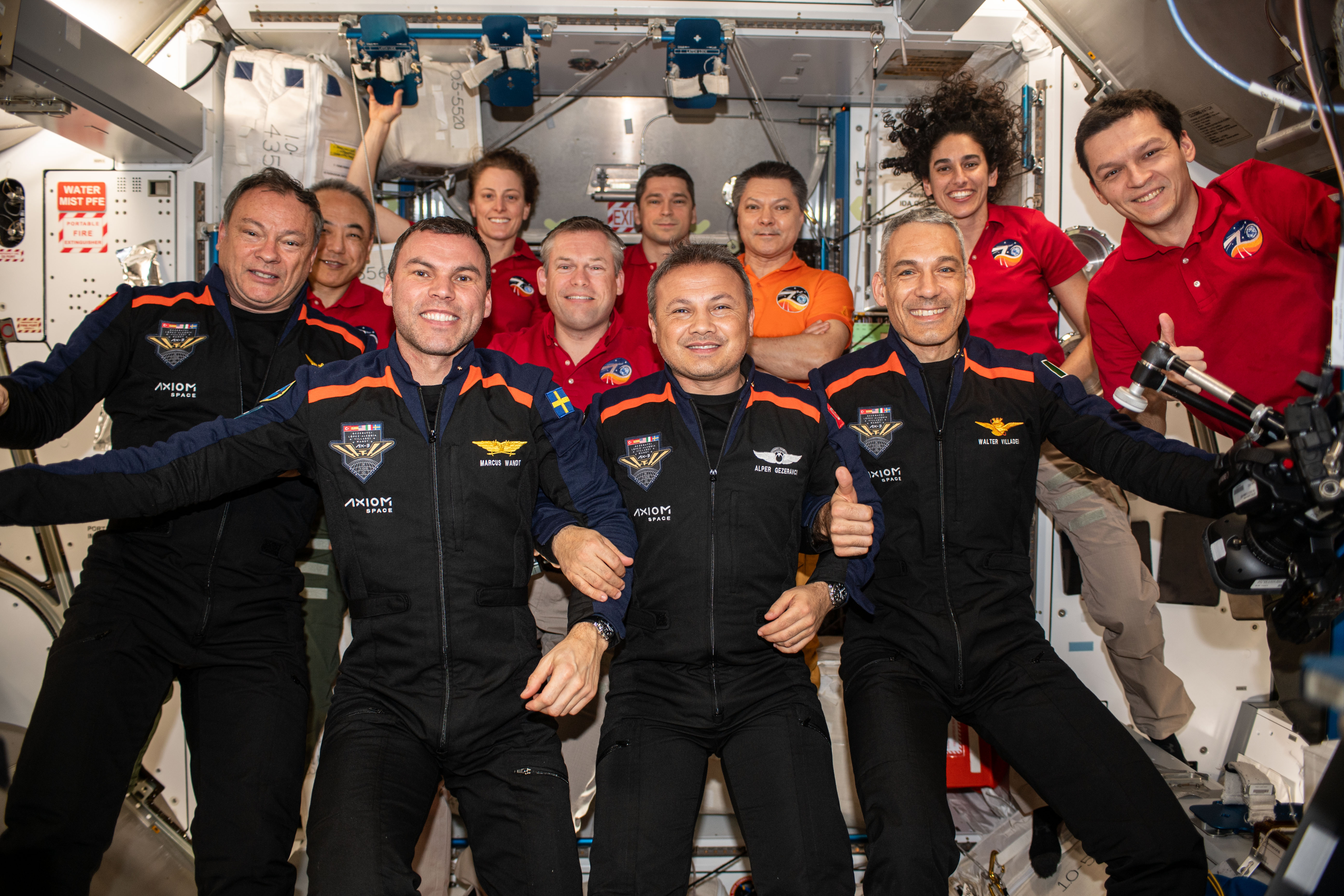 The 11 members of the Expedition 70 and Ax-3 crews, with Lopez-Alegria at far left