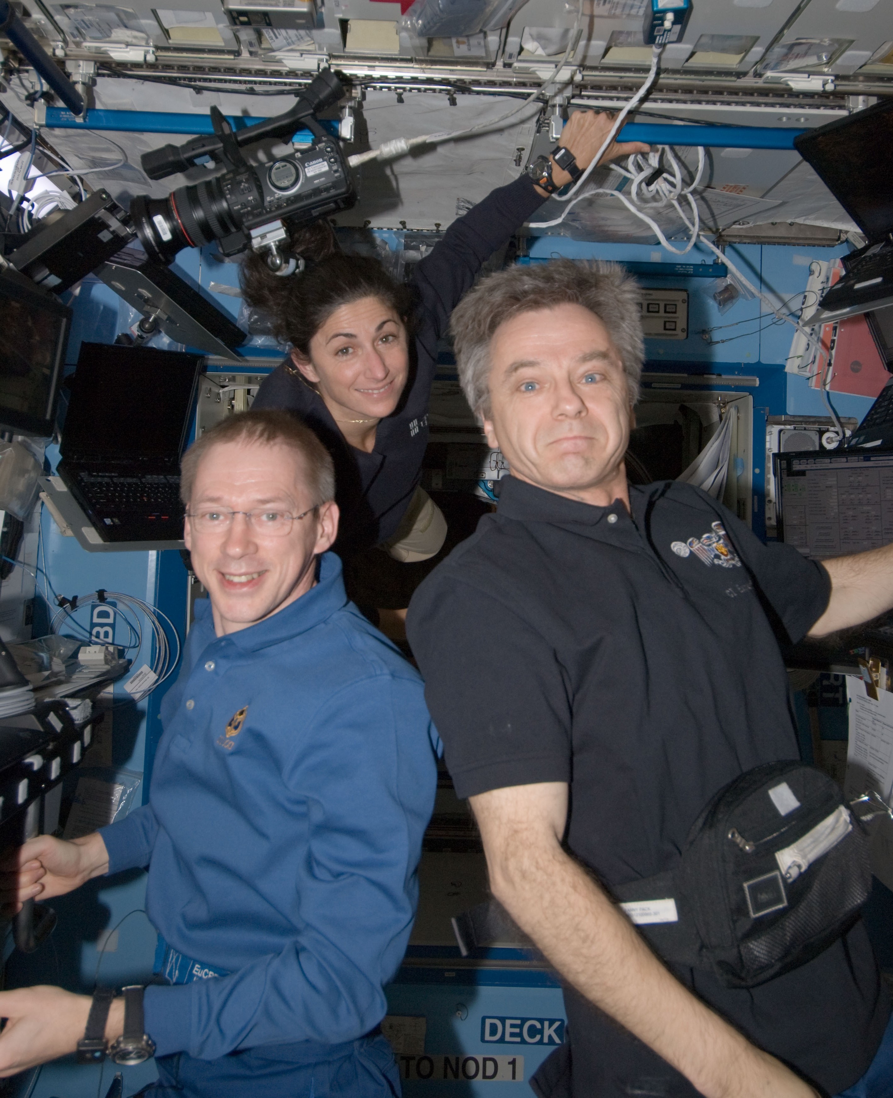 European Space Agency astronaut Frank DeWinne, left, Stott, and Canadian Space Agency astronaut Robert Thirsk in the Destiny module following the robotic operations to capture and berth HTV-1