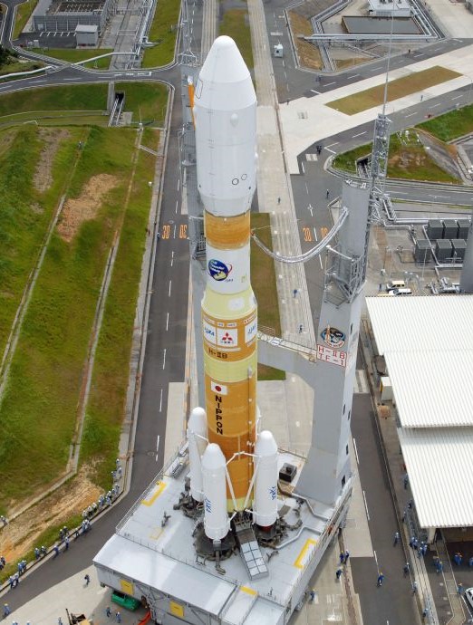 The HTV-1 atop its H-II rolls out of the VAB on its way to the launch pad