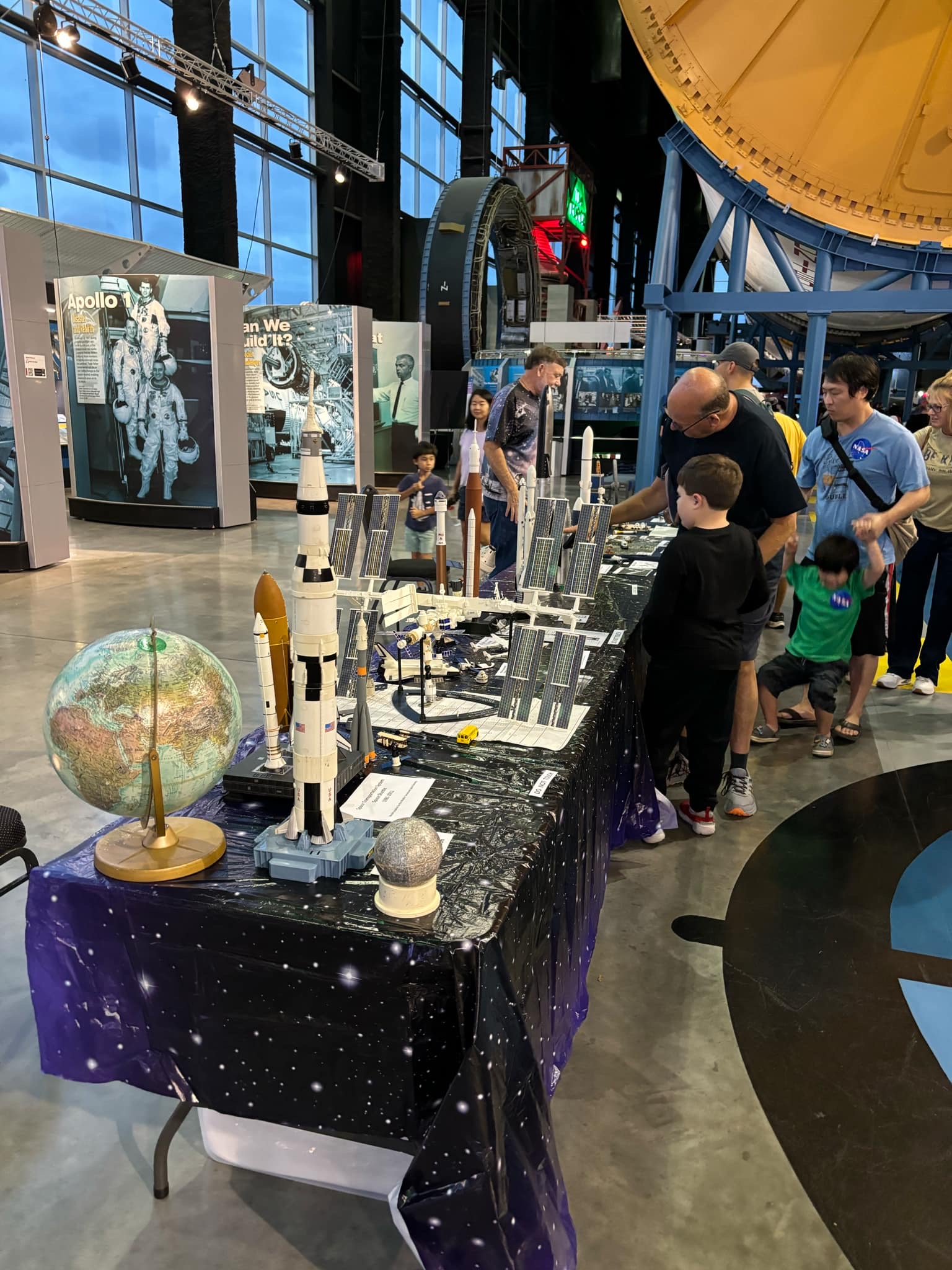 Attendees visit a NASA display during the Observe the Moon Night event.