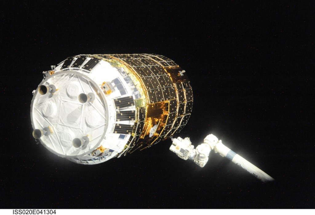 Backdropped by the blackness of space, the International Space Station's Canadarm2 prepares to grapple the unpiloted Japanese H-II Transfer Vehicle (HTV) as it approaches the station. NASA astronaut Nicole Stott, Canadian Space Agency astronaut Robert Thirsk and European Space Agency astronaut Frank De Winne, all Expedition 20 flight engineers, used the station's robotic arm to grab the cargo craft and attach it to the Earth-facing port of the Harmony node. The attachment was completed at 5:26 (CDT) on Sept. 17, 2009.