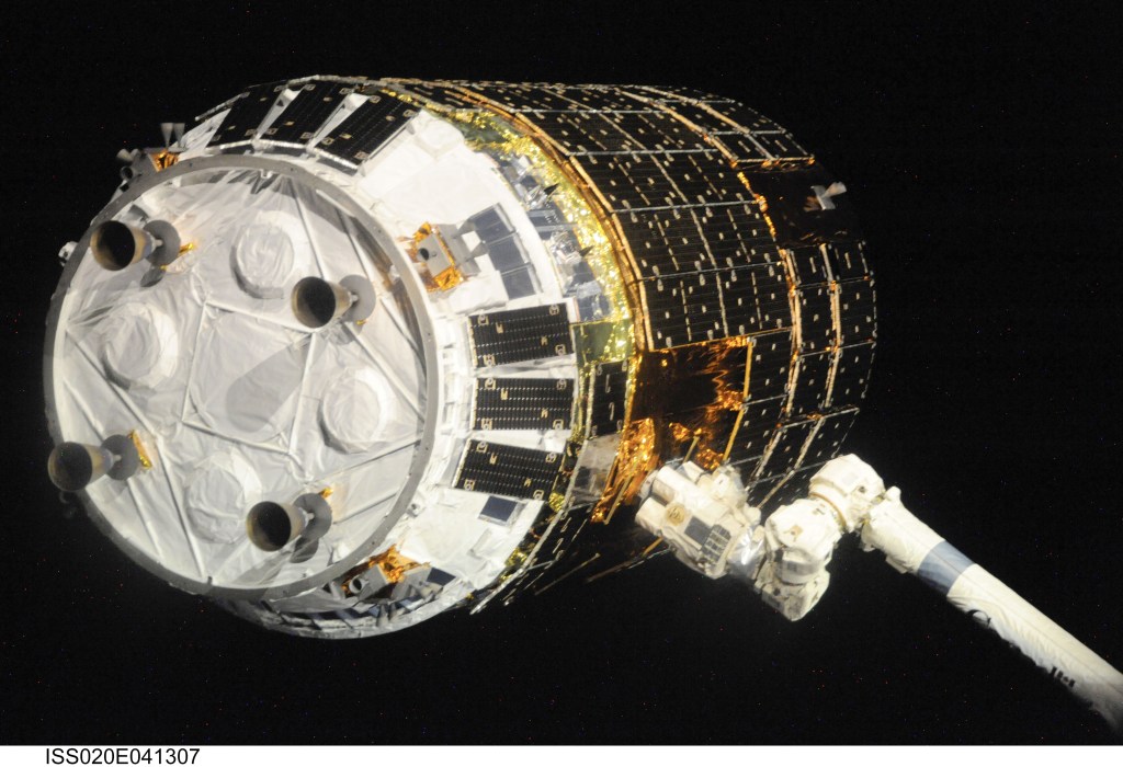 Backdropped by the blackness of space, the International Space Station's Canadarm2 grapples the unpiloted Japanese H-II Transfer Vehicle (HTV) as it approaches the station. NASA astronaut Nicole Stott, Canadian Space Agency astronaut Robert Thirsk and European Space Agency astronaut Frank De Winne, all Expedition 20 flight engineers, used the station's robotic arm to grab the cargo craft and attach it to the Earth-facing port of the Harmony node. The attachment was completed at 5:26 (CDT) on Sept. 17, 2009.