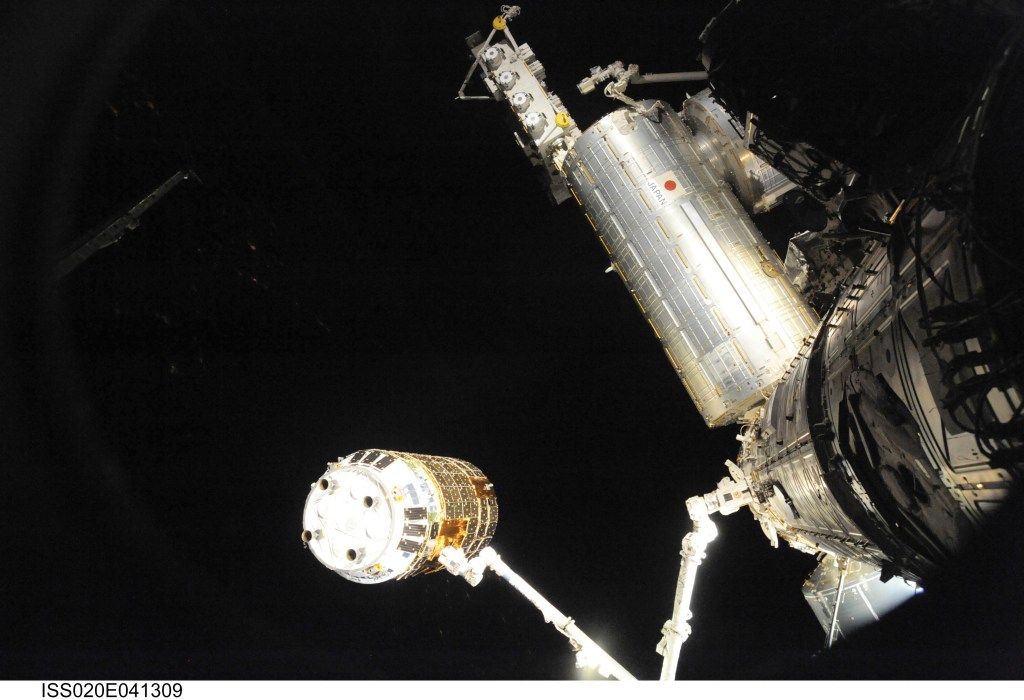 The Canadarm2 robotic arm grapples the Japanese H-II Transfer Vehicle (HTV) before installing the HTV to the Harmony module's Earth-facing port on the International Space Station. This was the Canadarm2's first free-flying capture of a spacecraft and the first flight of the HTV cargo craft from JAXA (Japan Aerospace Exploration Agency).