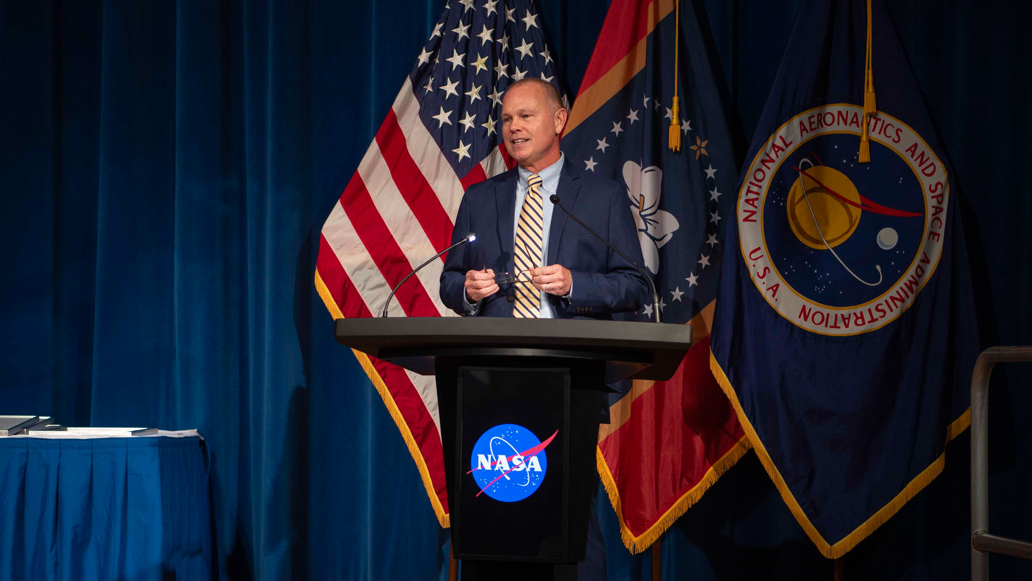 NASA Stennis Director John Bailey welcomes employees and guests to the Silver Snoopy Award ceremony