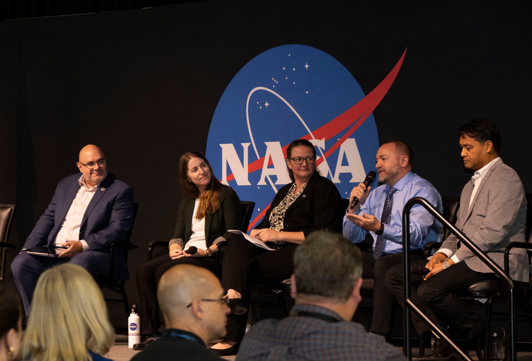 Molthan answers a question during the Climate Town Hall. Topics discussed during the town hall included the response by NASA and Marshall to climate change, the effects of climate change on NASA and Marshall objectives, and how NASA and Marshall are helping organizations around the world respond to climate change.