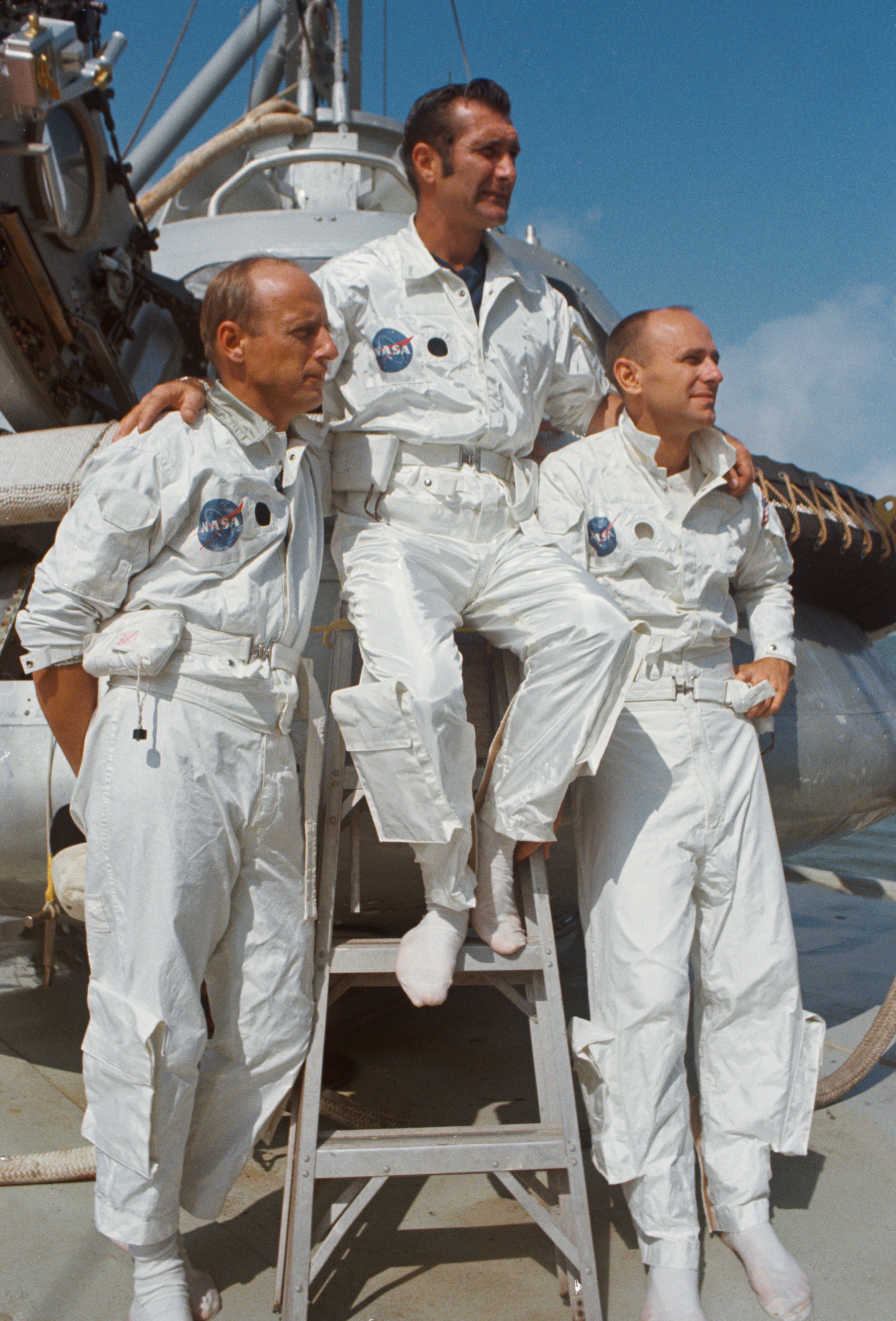 Apollo 12 astronauts Charles “Pete” Conrad, left, Richard F. Gordon, and Alan L. Bean prepare for water egress training aboard the MV Retriever in the Gulf of Mexico