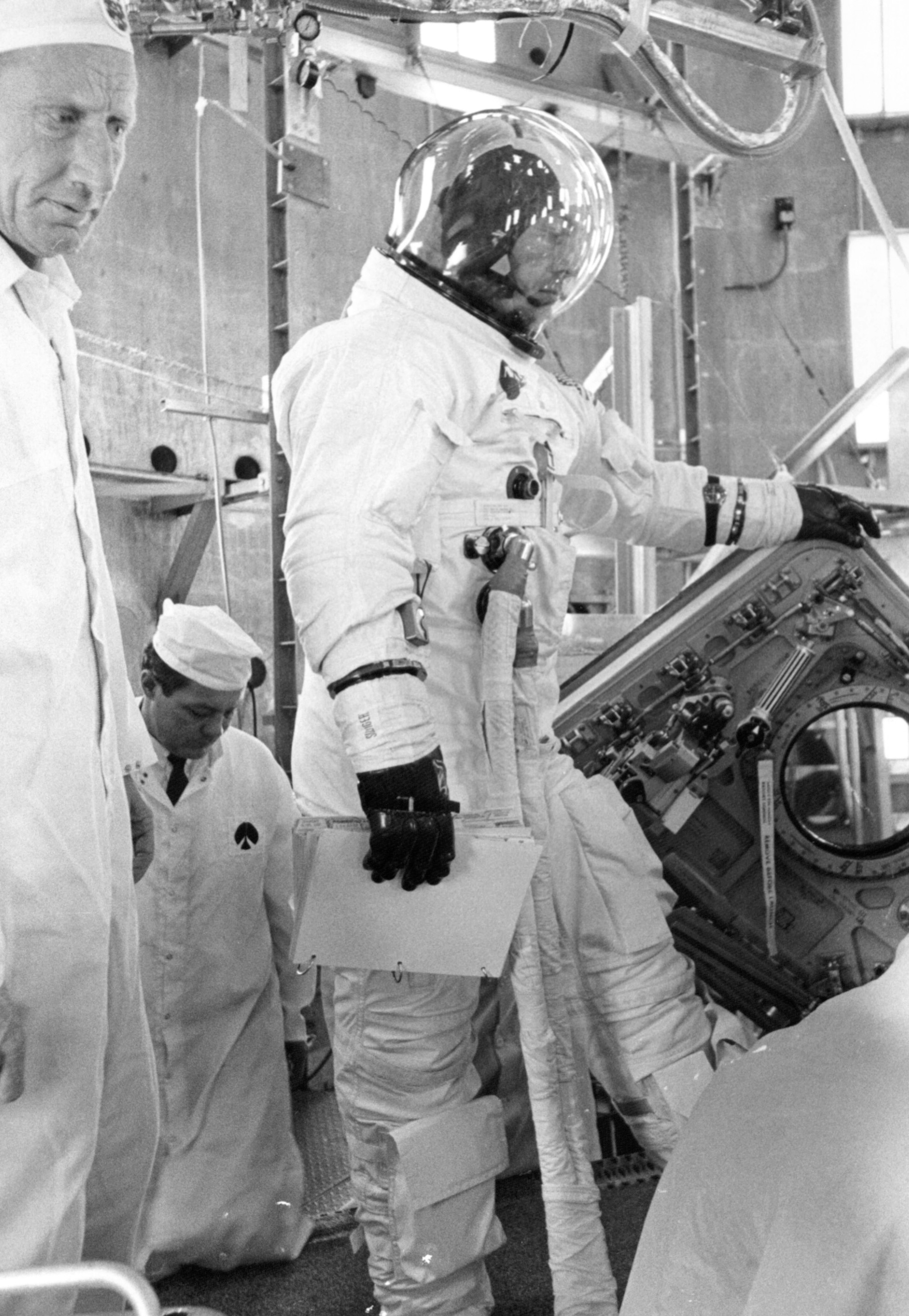 Apollo 13 backup astronaut John L. “Jack” Swigert prepares to enter the CM for an altitude chamber test