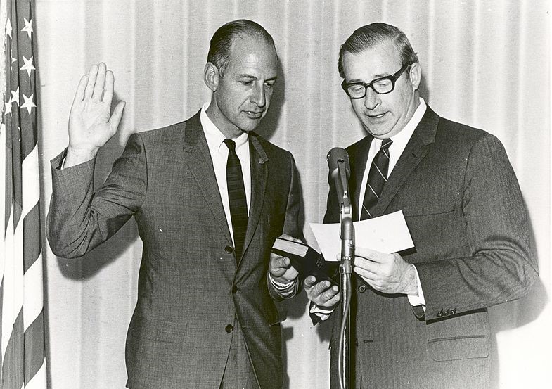 NASA Administrator Thomas O. Paine, right, swears in George M. Low as NASA deputy administrator