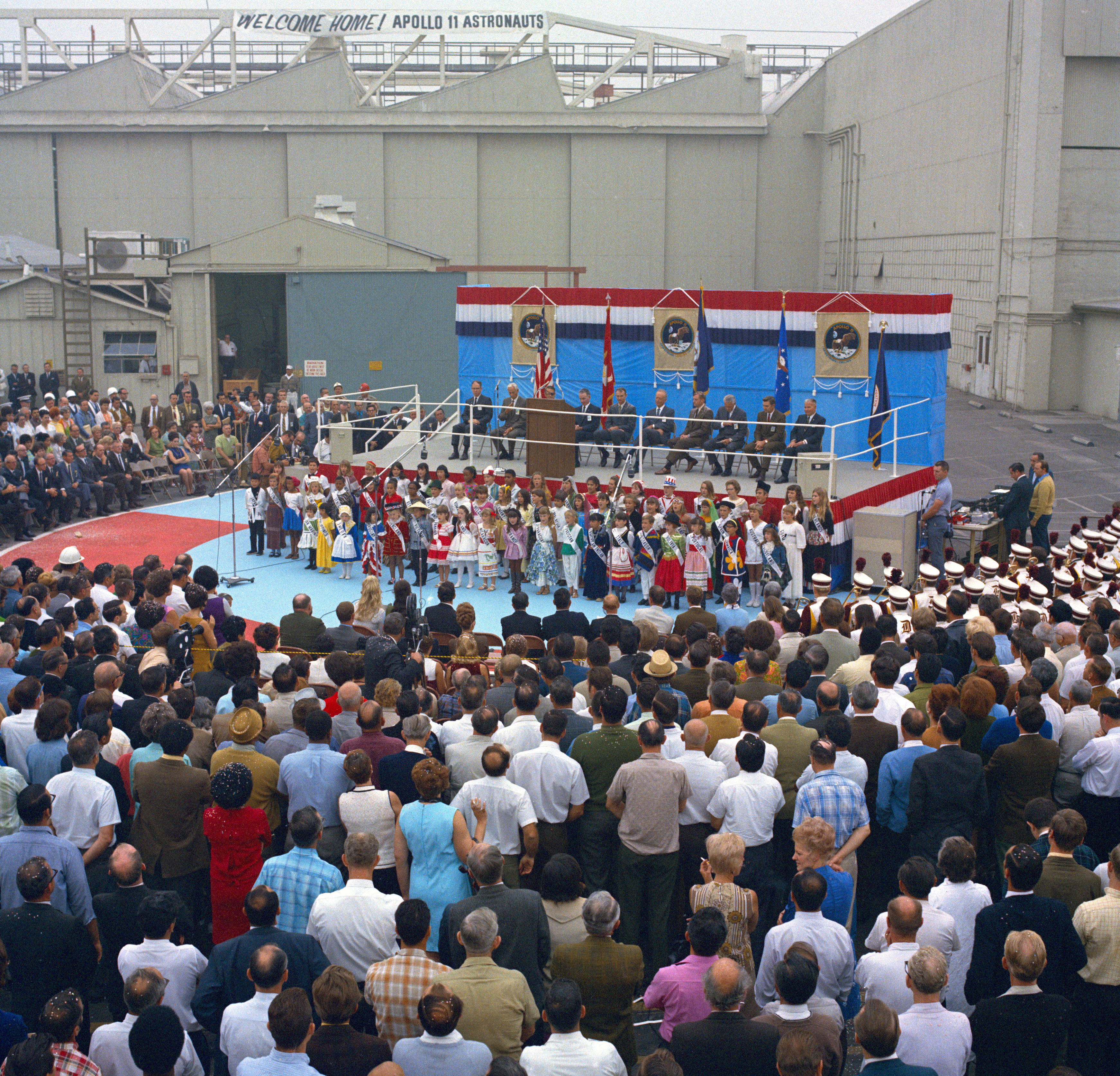 Neil A. Armstrong and Michael Collins address North American Rockwell employees in Downey, California