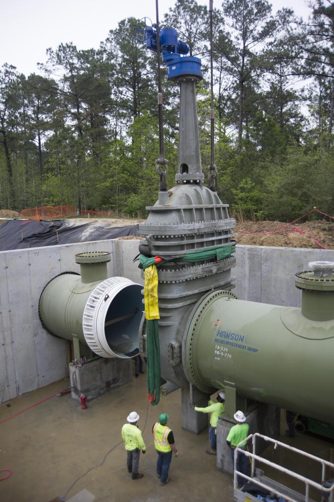 Employees install a 96-inch valve near the Thad Cochran Test Stand (B-1/B-2) at NASA's Stennis Space Center.