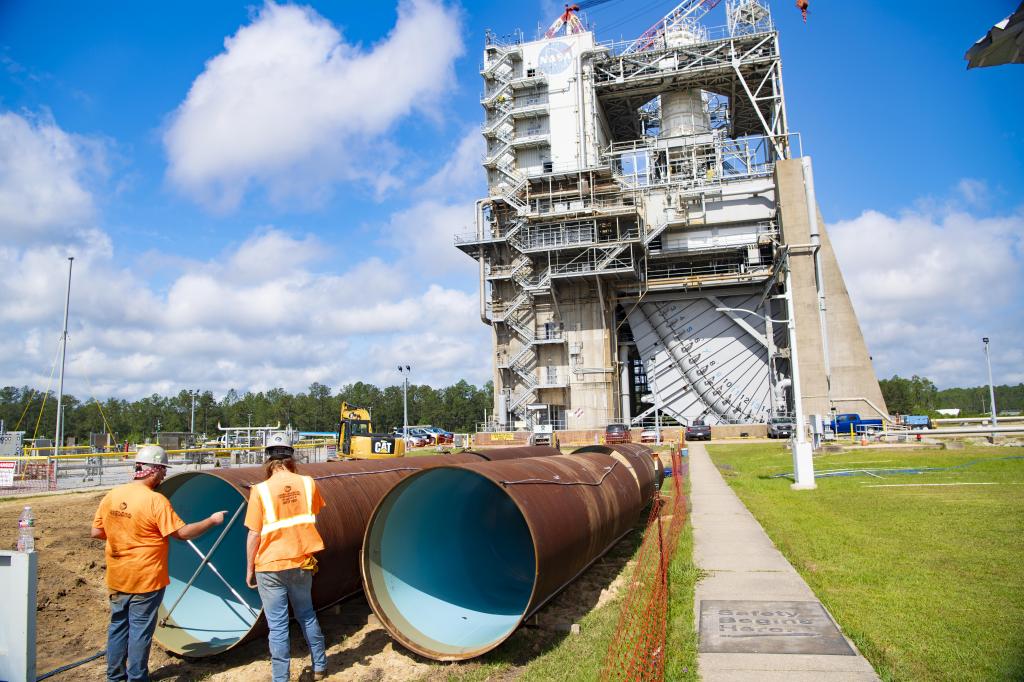 Crews prepare new pipeline liner sections for installation near the Fred Haise Test Stand in 2024.