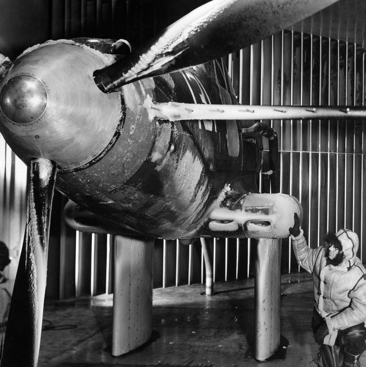 A black and white image close look at how ice formed on this propeller blade model inside the Icing Research Tunnel.