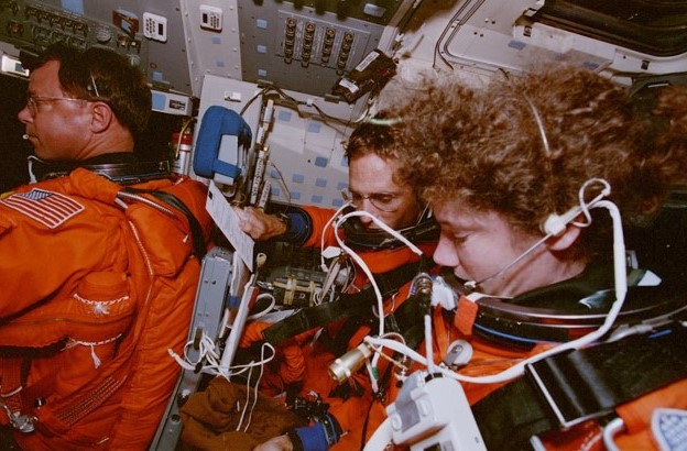 Pilot L. Blaine Hammond, left, and Mission Specialists Carl J. Meade and Susan J. Helms prepare for reentry