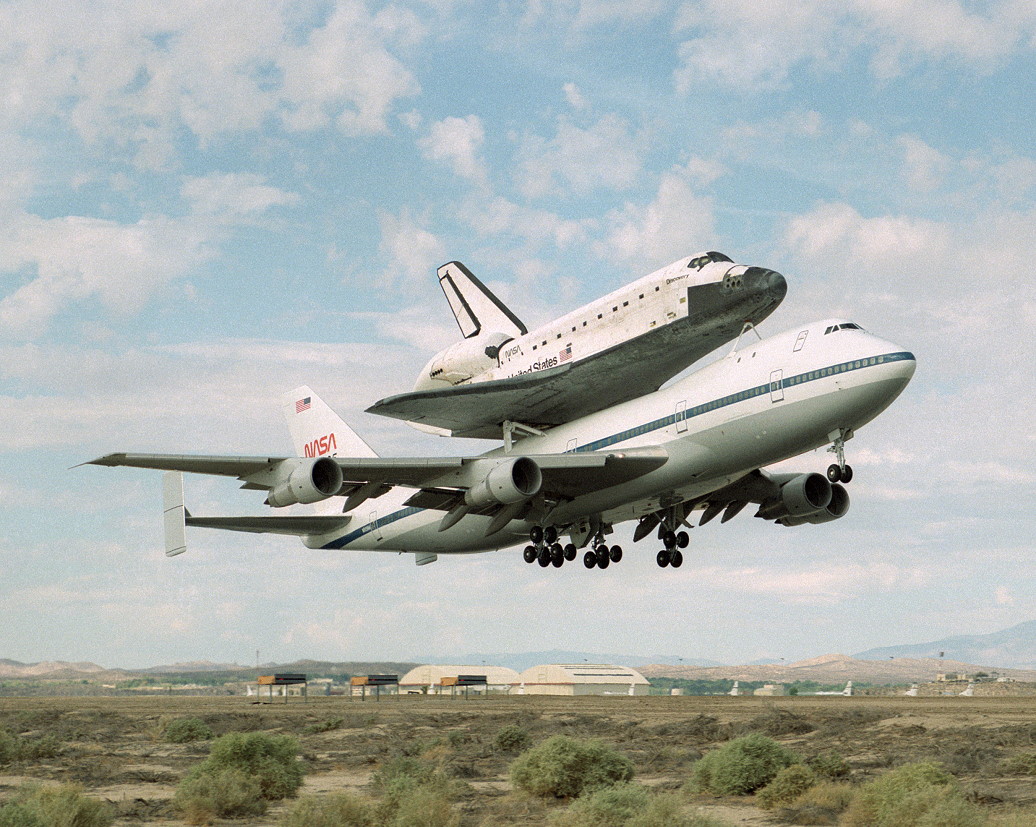 Discovery takes off from Edwards atop a Shuttle Carrier Aircraft for the ferry flight to NASA’s Kennedy Space Center in Florida