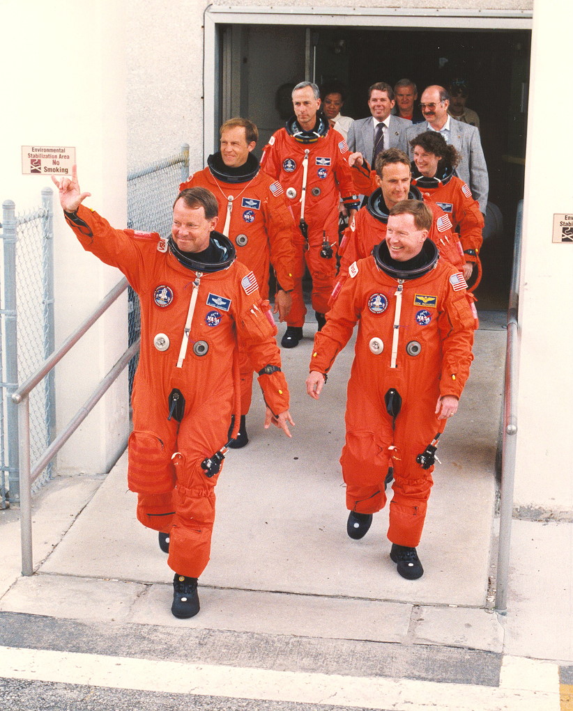 The STS-64 crew exits crew quarters at KSC on their way to the launch