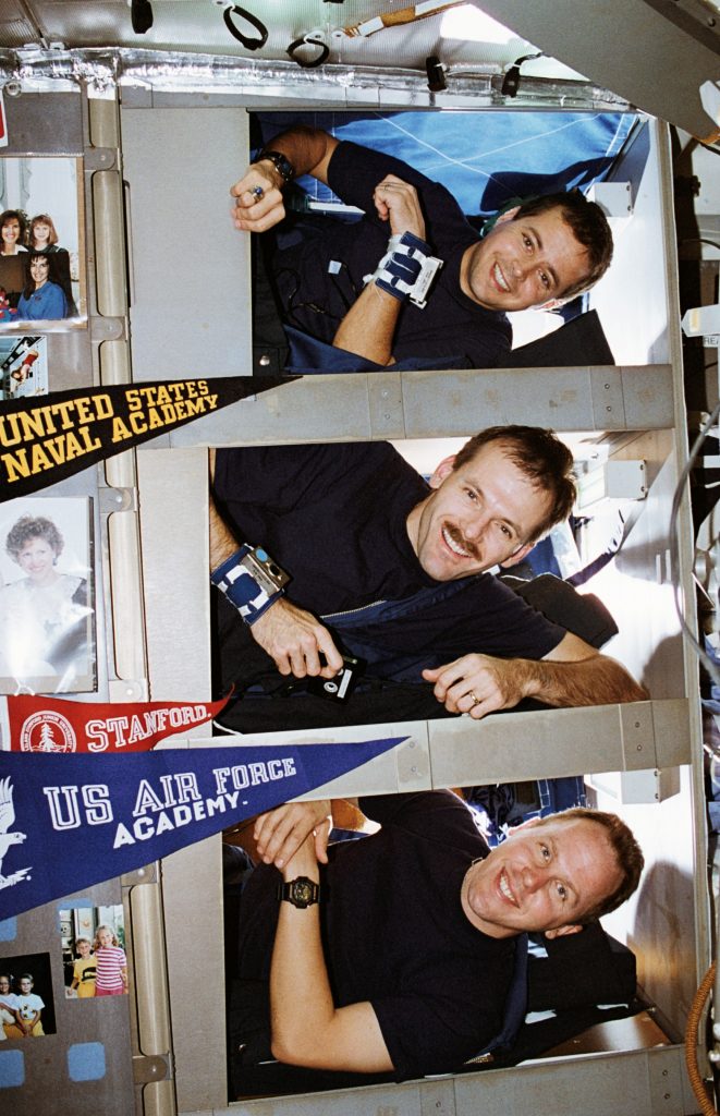 The STS-68 Blue Team of Daniel W. Bursch, top, Steven L. Smith, and Thomas D. Jones in their sleep bunks