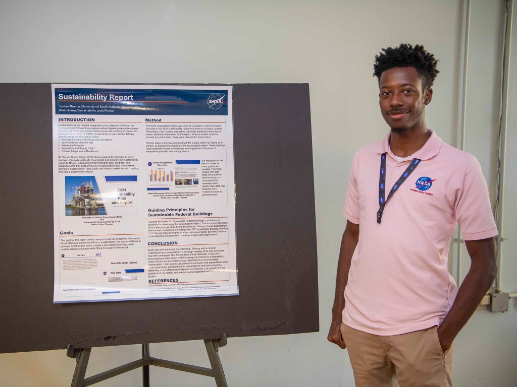 NASA Stennis summer intern Jordan Thomas is shown with his presentation on the 2024 Sustainability Report for NASA Stennis