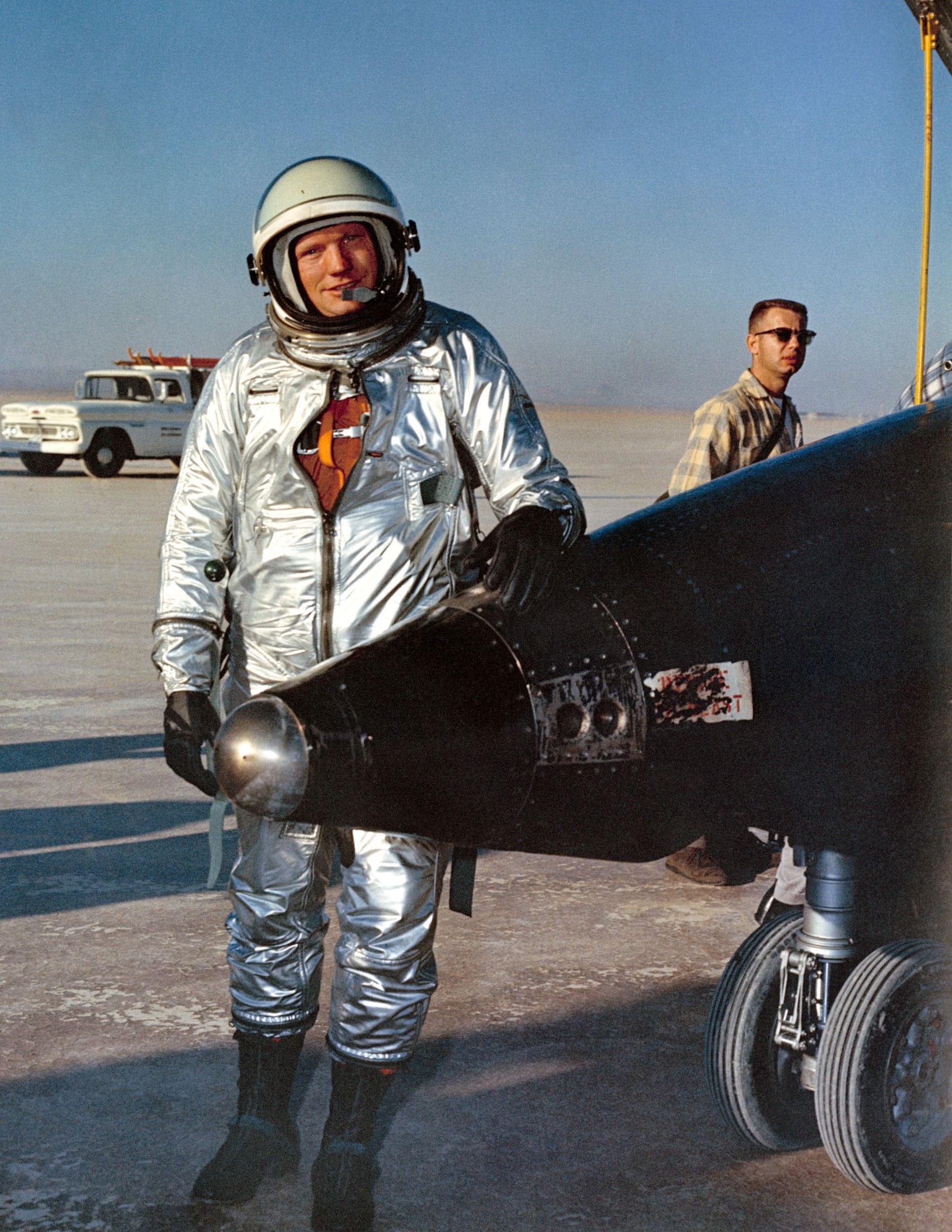 NASA pilot Neil A. Armstrong stands next to an X-15.