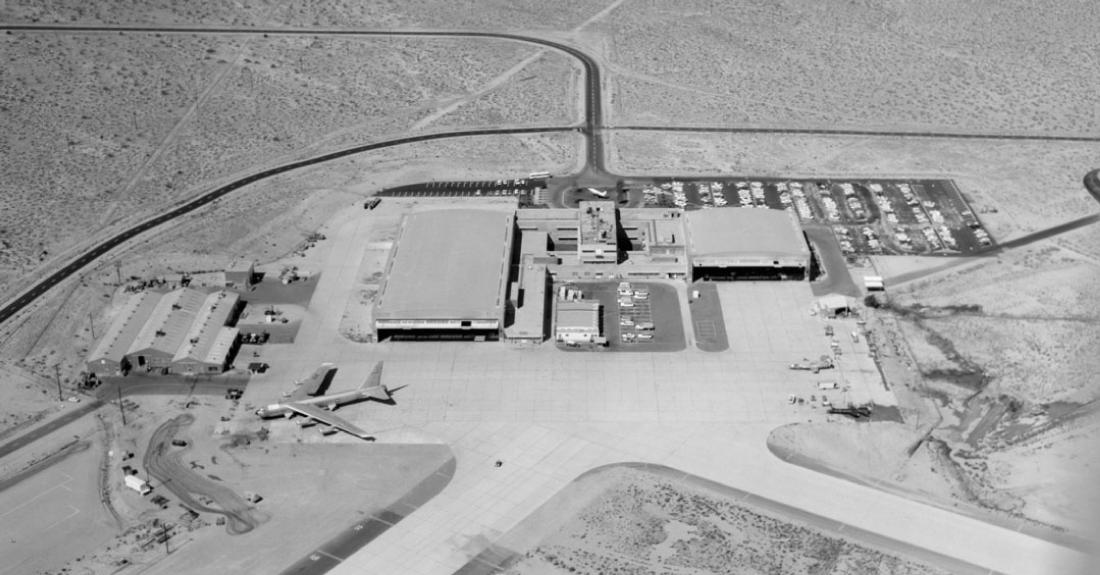 Aerial view of the Flight Research Center, now NASA's Armstrong Flight Research Center, at Edwards Air Force Base, California, with one of the B-52 carrier aircraft at left and an X-15 at right.