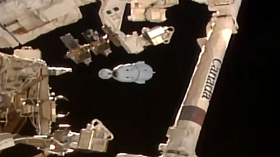 The SpaceX Dragon Endeavour spacecraft is pictured beyond the Candarm2 robotic arm moments after undocking from the Harmony module with four Crew-8 members. Credit: NASA TV