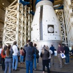 A group of Marshall team members gather below the development test article for the universal stage adapter that will be used on the second variant of SLS, called Block 1B. The universal stage adapter is located inside one of the high bays in building 4619. The universal stage adapter will connect the Orion spacecraft to the SLS exploration upper stage. With the exploration upper stage, which will be powered by four RL10-C3 engines, SLS will be capable of lifting more than 105 metric tons (231,000 pounds) from Earth’s surface. This extra mass capability enables SLS to send multiple large payloads to the Moon on the same launch.