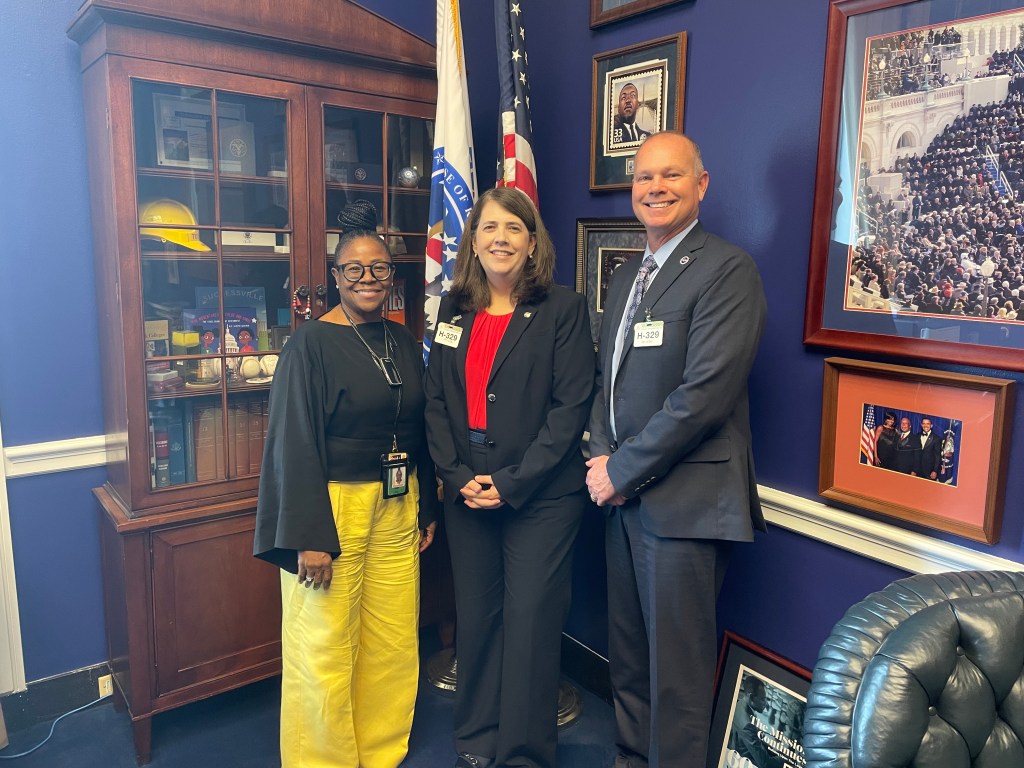 NASA Stennis Deputy Director Christine Powell, center, and NASA Stennis Director John Bailey, right, stand with Dr. Timla Washington, chief of staff for U.S. Rep. Bennie Thompson of Mississippi