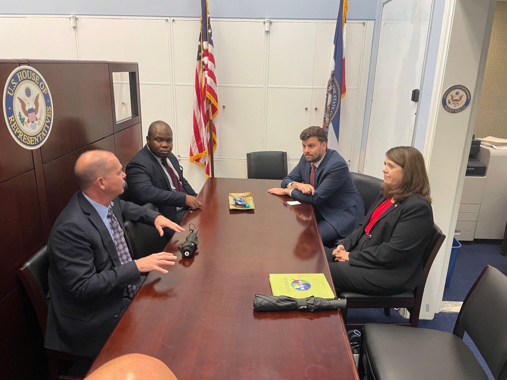 NASA Stennis Director John Bailey, near left, and NASA Stennis Deputy Director Christine Powell, near right, are seated at conference table with Semaj Redd, operations and legislative assistant for U.S. Rep. Trent Kelly of Mississippi, and Reed Craddock, deputy chief of staff for U.S. Rep. Trent Kelly of Mississippi.