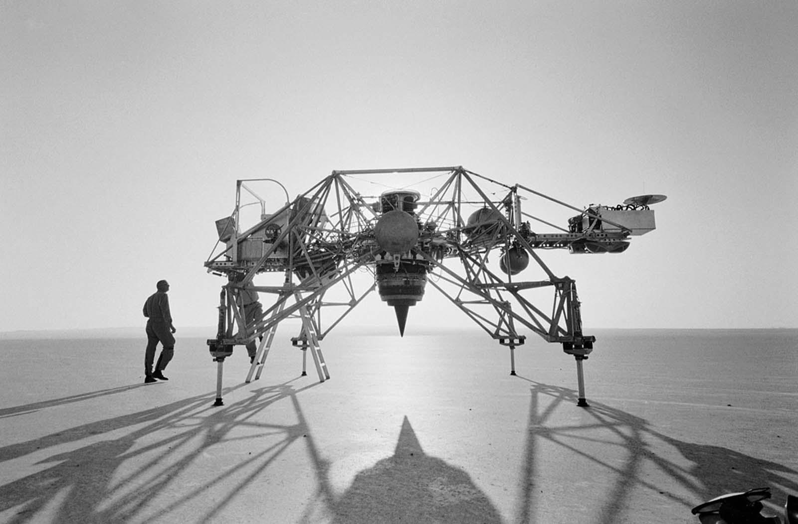 The first Lunar Landing Research Vehicle silhouetted against the rising sun on the dry lakebed at Edwards Air Force Base in California's Mojave Desert