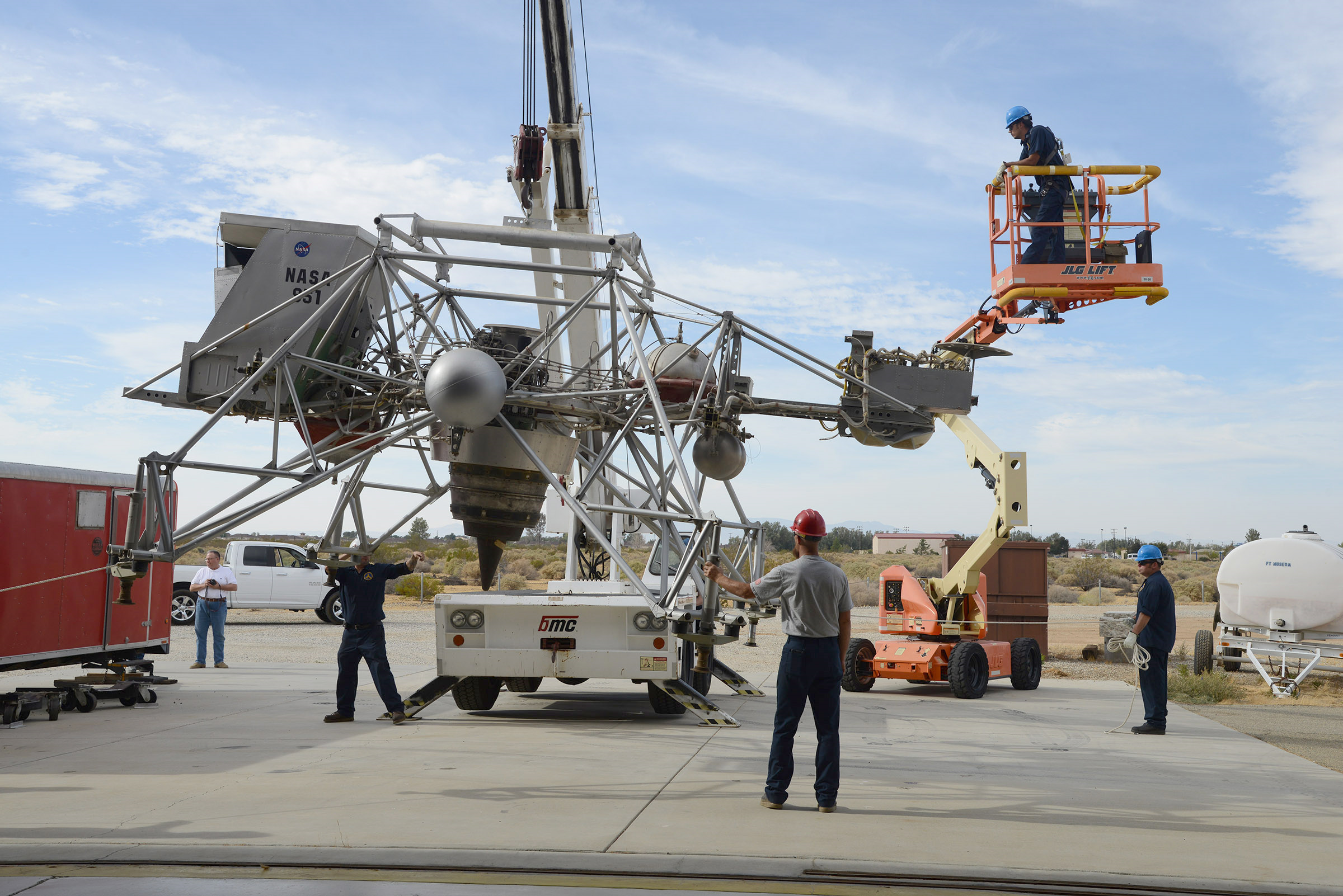 Workers move Lunar Landing Research Vehicle-2 from NASA's Armstrong Flight Research Center for display at the Air Force Test Flight Museum