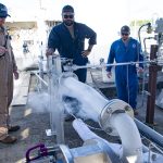 A test team personnel inspecting a pump during an initial chill down activity at the E-3 Test Complex