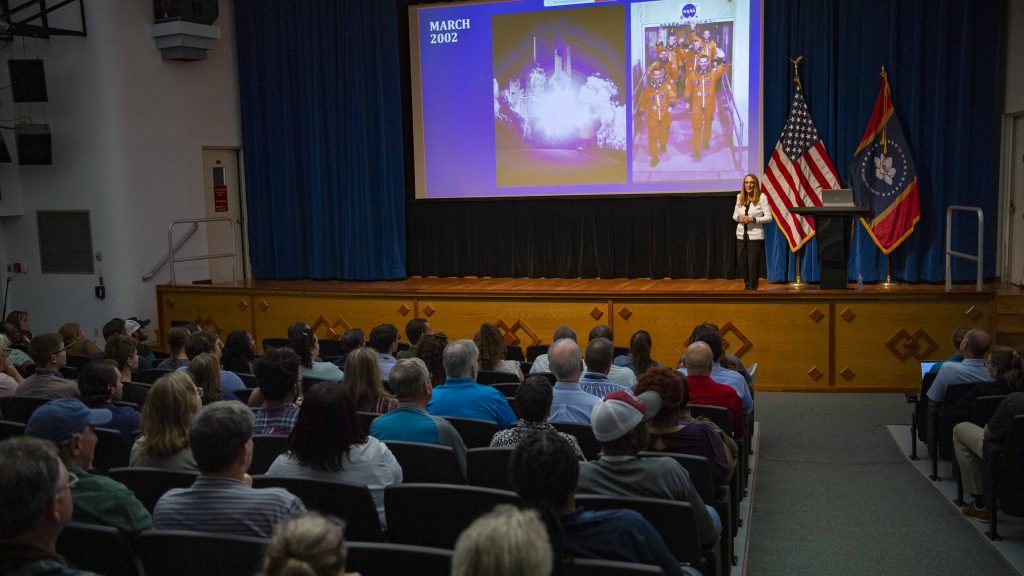 Stennis employees seated in the auditorium listening to Former NASA astronaut Dr. Nancy Currie-Gregg