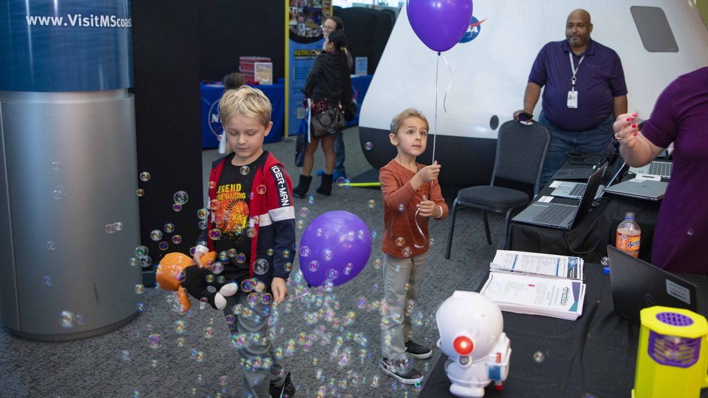 Young attendees enjoy activities provided by participating organizations of the NASA Stennis federal city.