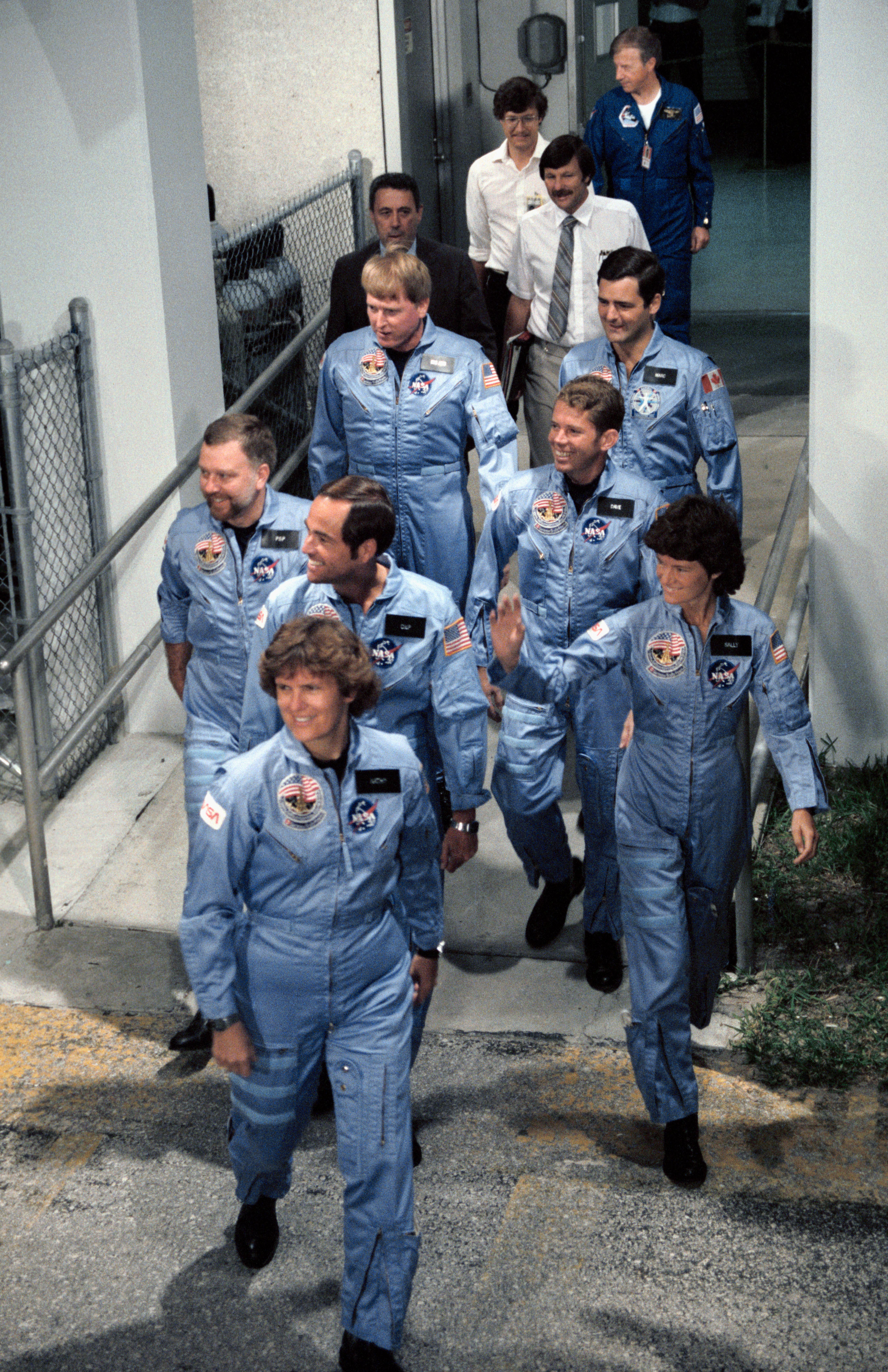 The STS-41G crew leaves crew quarters and prepares to board the Astrovan for the ride to Launch Pad 39A for liftoff