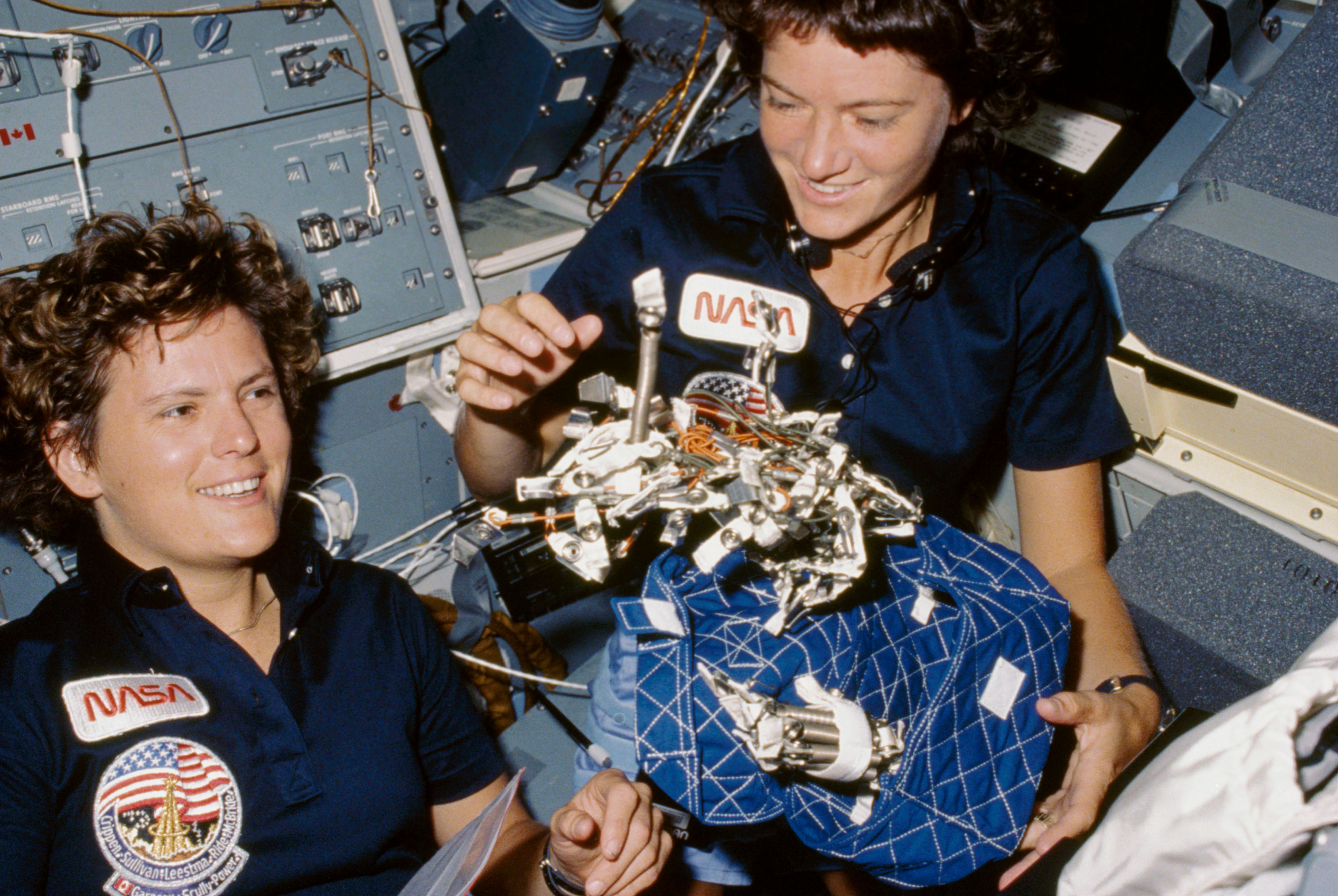 Mission Specialists Kathryn D. Sullivan, left, and Sally K. Ride on Challenger’s flight deck