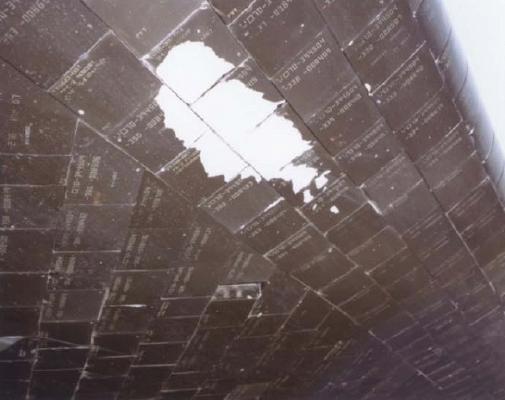 Damage to tiles on Challenger's left wing