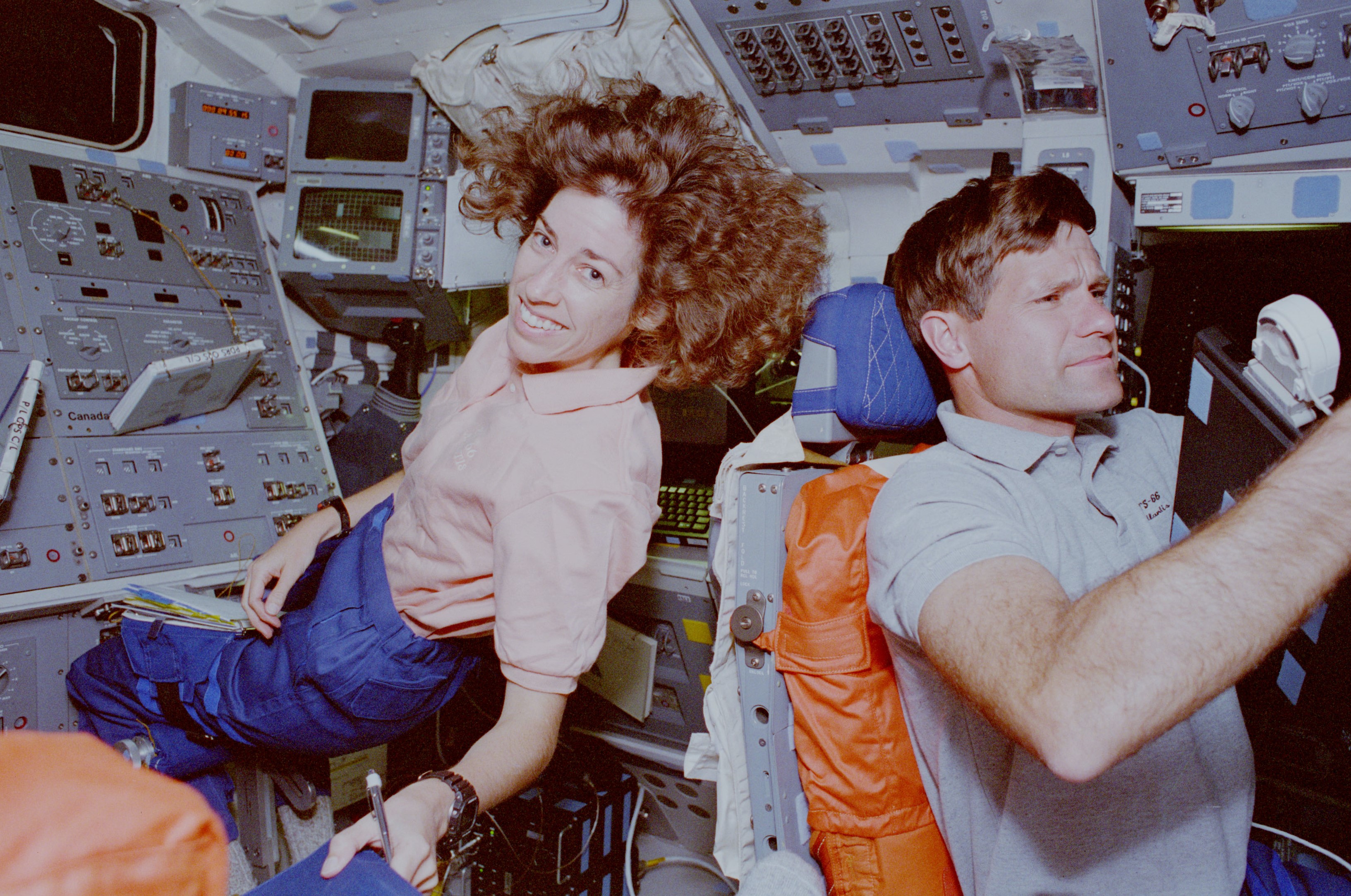 Ellen Ochoa and Donald R. McMonagle on the shuttle's flight deck