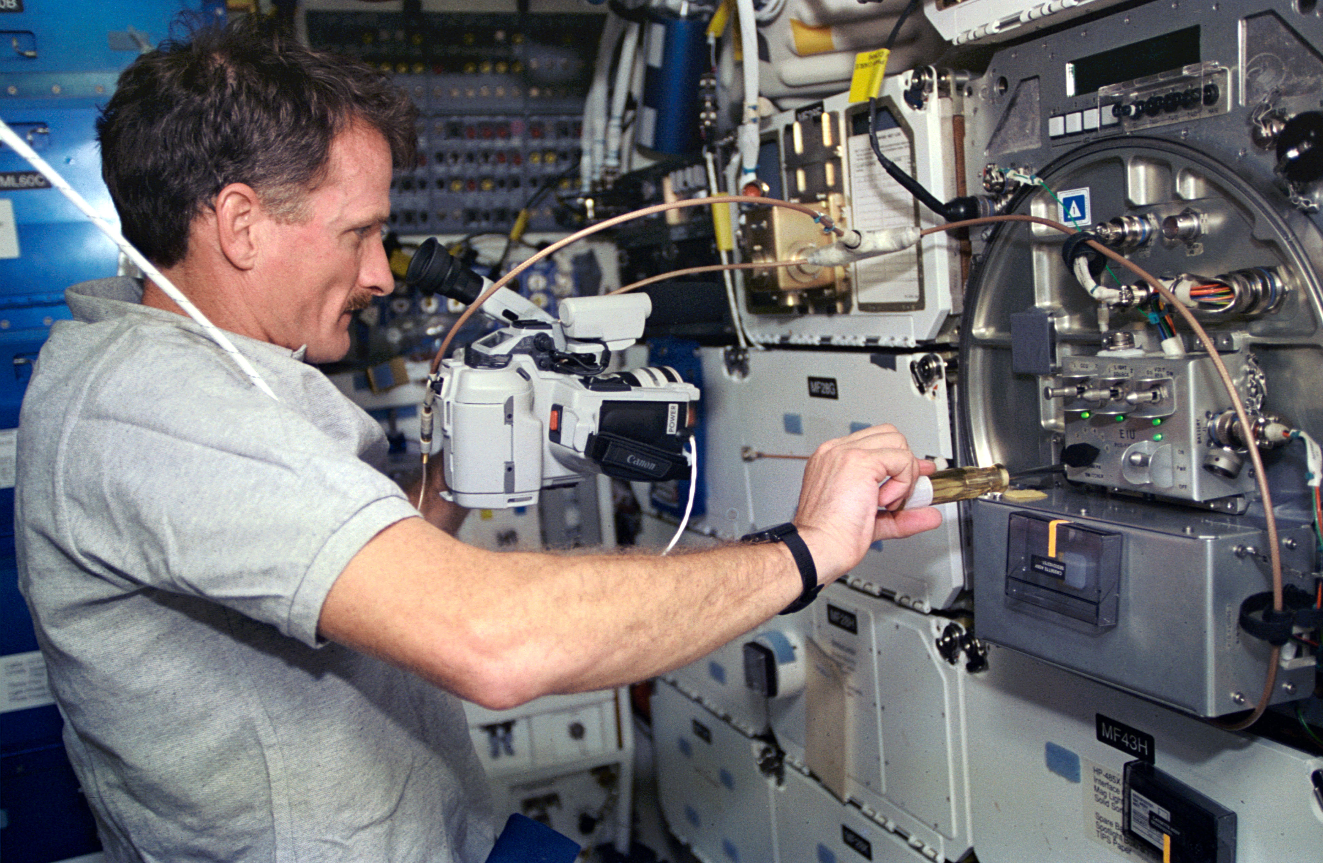 Joseph R. Tanner operates a protein crystallization experiment