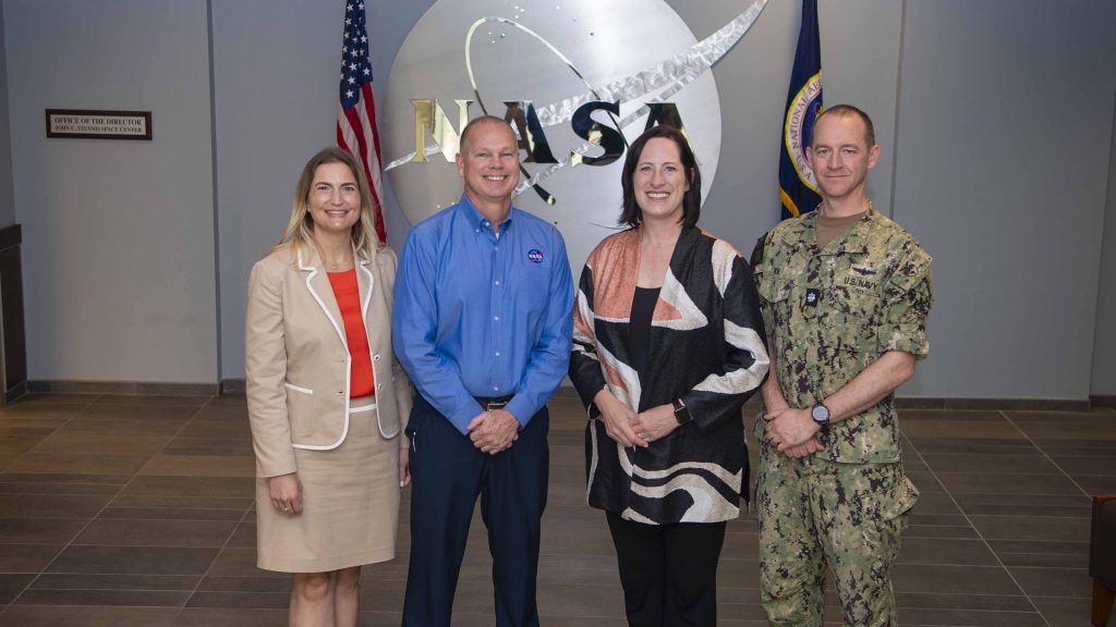 Leah Thorstenson, foreign policy advisor with the U.S. Marines Corps. Forces South., Heide Fulton, U.S. Ambassador to the Oriental Republic of Uruguay, Cmdr. Brendan Rok, chief of the U.S. Navy Office of Defense Cooperation at the U.S. Embassy in Montevideo, Uruguay, and NASA Stennis Director John Bailey stand for photo outside of the Office of the Director