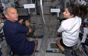 (From left) Jeff Williams and Nicole Stott, both retired NASA astronauts, are pictured voting from space during Expedition 21. Credit: NASA