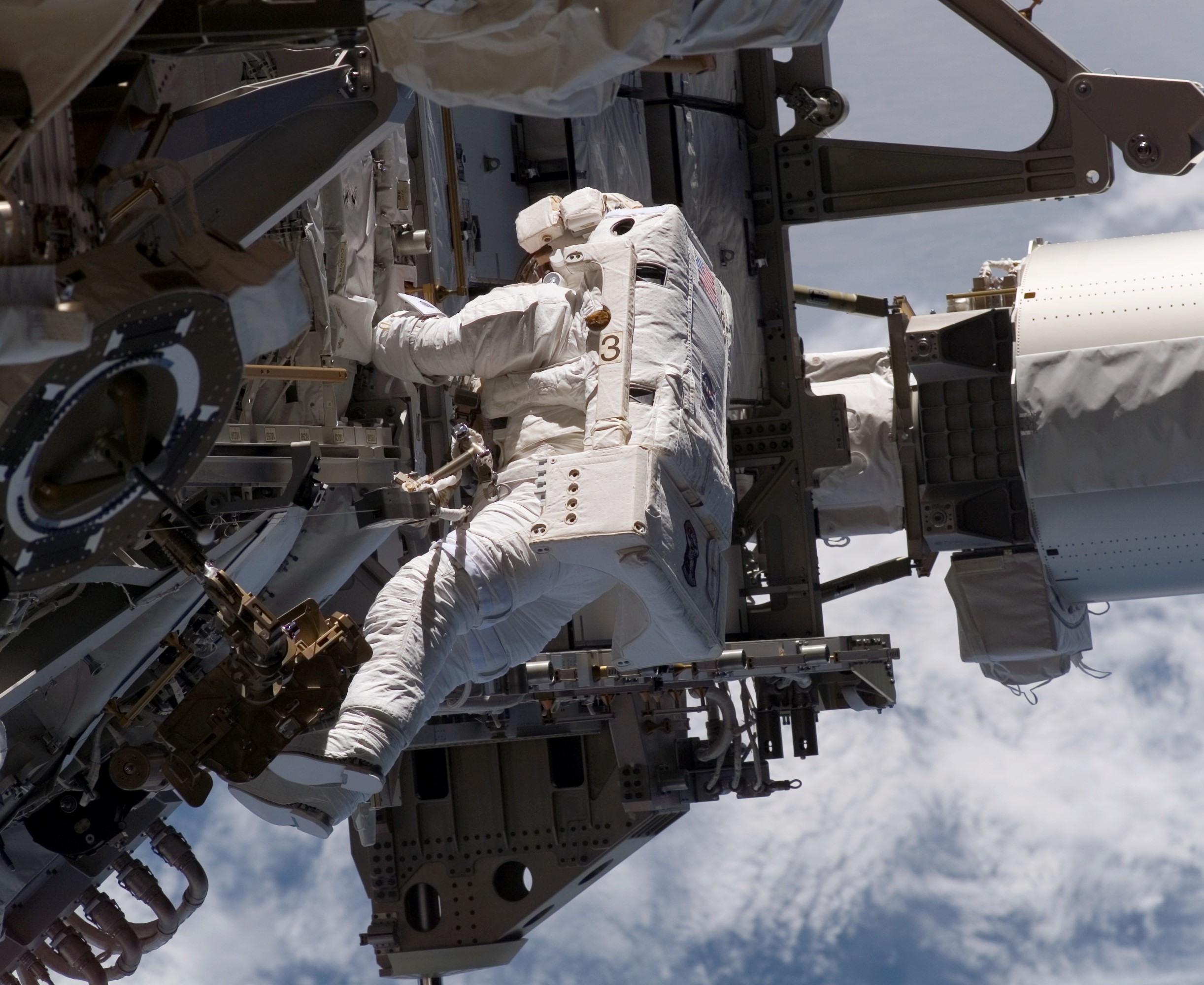 During STS-115, NASA astronaut Heidemarie M. Stefanyshyn-Piper conducts the first of her five career spacewalks