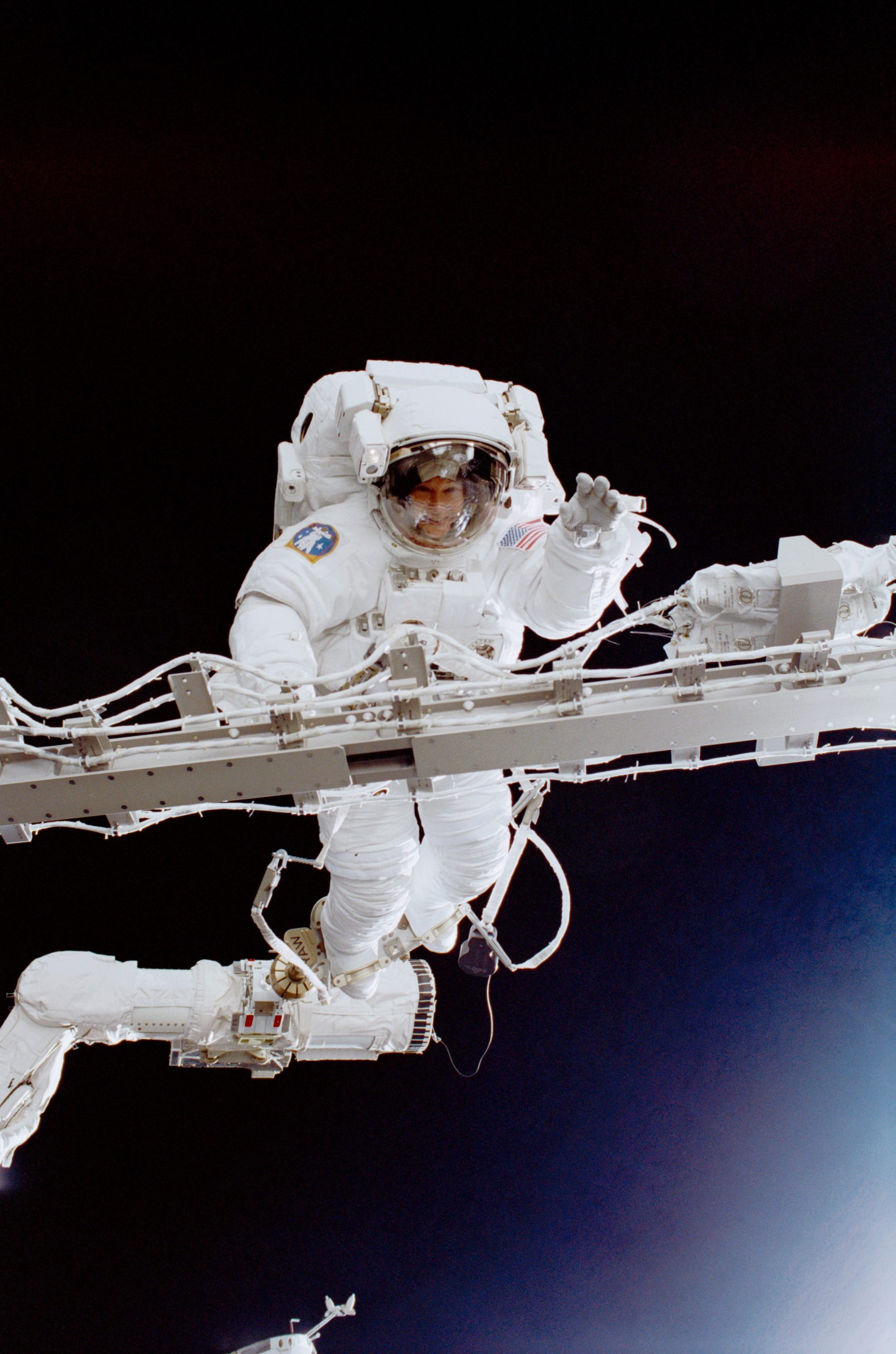 Expedition 2 NASA astronaut Susan J. Helms, the first female long-duration crew member to conduct a spacewalk during the STS-102 docked phase